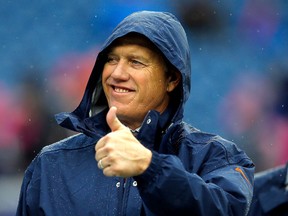 Denver Broncos executive John Elway gestures before a National Football League game against the New England Patriots at Gillette Stadium in Foxboro, Mass., in October 2012.