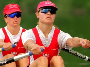 FILE - Canadian rower Kathleen Heddle, right, a three-time Olympic gold medalist, has died from cancer at the age of 55.