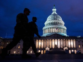 Members of the US National Guard patrol at the US Capitol in Washington, DC on January 17, 2021.