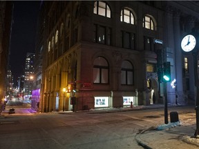 A clock shown shortly after 8 p.m on the corner of an empty street in Montreal in Saturday, Jan. 9, 2021, as the COVID-19 pandemic continues in Canada and around the world. The Quebec government has imposed a curfew to help stop the spread of COVID-19 starting at 8 p.m until 5 a.m and lasting until Feb. 8.