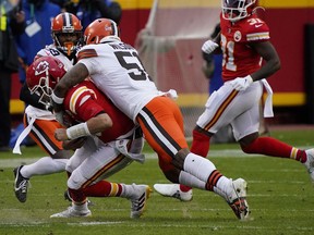 Kansas City Chiefs quarterback Patrick Mahomes (15) is brought down by Cleveland Browns outside linebacker Mack Wilson (51) during the second half in the AFC Divisional Round playoff game at Arrowhead Stadium. Mahomes would suffer an injury on the play.