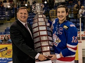 BCHL commissioner Chris Hebb presents the championship trophy for the 2018-19 season to the Prince George Spruce Kings, the last time a league champion was crowned.