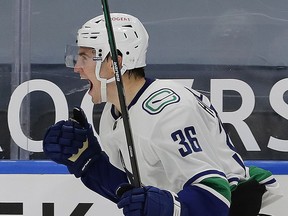 Nils Höglander celebrates his first career NHL goal during the Canucks’ season-opening win in Edmonton on Jan. 13. ‘I work hard and try to learn every day and it’s hard, but it feels good,’ he says.