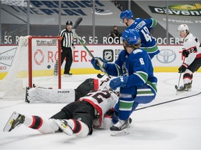 Vancouver Canucks forward Elias Pettersson (40) scores on Ottawa Senators goalie Matt Murray (30) in the first period at Rogers Arena.