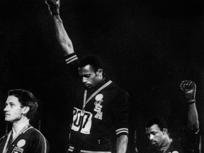 Forty years after Tommie Smith, centre, and John Carlos raised their fists in a civil rights gesture on the Olympic medal stand in Mexico City, protests on the podium could make a comeback in Beijing.
