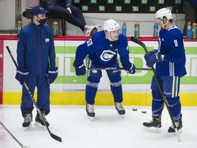 Vancouver Canucks captain Bo Horvat, centre, liked what he saw during Friday's training camp at Rogers Arena. The Canucks open their NHL regular season on Wednesday in Edmonton.