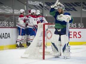 Vancouver Canucks goalie Braden Holtby reacts after a goal by the Montreal Canadiens in the second period of play at Rogers Arena Saturday.