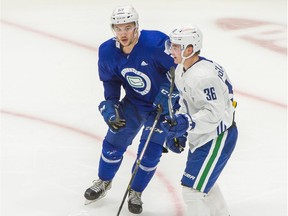 Vancouver Canucks Jett Woo (left) and Nils Hoglander play in a scrimmage game at Rogers Arena on Jan. 6, 2021.