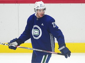 Travis Hamonic on the ice during the Canucks training camp at Rogers Arena earlier this month. Hamonic is dealing with an ‘upper-body injury’ after Wednesday’s regular season opener against Montreal, Canucks GM Jim Benning said Thursday.