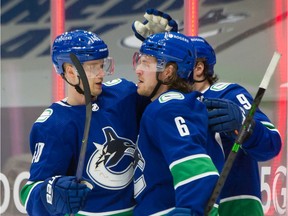 VANCOUVER, BC - January 28, 2021  -  Vancouver Canucks Elias Pettersson congratulates Brock Boeser for his 2nd period goal vs Ottawa Senators in NHL hockey at Rogers Arena in Vancouver, BC, January 28, 2021. 

Photo by Arlen Redekop / Vancouver Sun / The Province (PNG) (story by reporter) [PNG Merlin Archive]