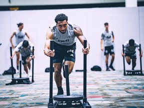Whitecaps forward Theo Bair does exercises during a gym session in preparation for the MLS is Back tournament in Orlando this summer.