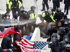 Pro-Trump protesters clash with Capitol police during a rally to contest the certification of the 2020 U.S. presidential election results by the U.S. Congress, at the U.S. Capitol Building in Washington, D.C., on Jan. 6, 2021.