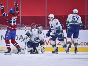 It’s been that kind of season so far for Vancouver Canucks like goalie Thatcher Demko and blueliners Nate Schmidt and Tyler Myers (right), as they’ve been filled in by opponents like Montreal Canadiens winger Josh Anderson (left), here celebrating one of his two first-period goals in the Habs’ 5-3 win over the visiting Canucks on Tuesday.