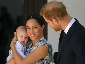 Britain's Prince Harry and his wife Meghan, Duchess of Sussex, holding their son Archie.