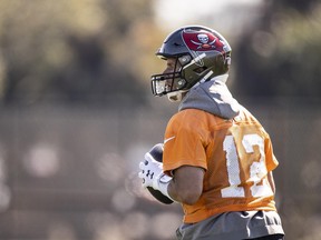 Buccaneers quarterback Tom Brady limbers up during a Super Bowl practice on Thursday in Tampa.