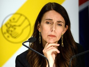 Prime Minister Jacinda Ardern listens to reporters' questions on February 14, 2021 in Wellington, New Zealand.