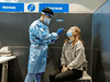 A passenger receives a COVID-19 test at Toronto's Pearson airport on February 1, 2021. The new antigen COVID test will be used starting March 1 in a federal research project at the airport.