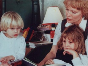 Mia Farrow with her children Ronan, left, and Dylan, right.
