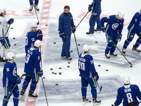 Canucks head coach Travis Green prepares to begin practice during the NHL team's training camp in Vancouver on Jan. 8.