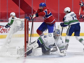 Montreal Canadiens defenceman Jeff Petry (26) scores a goal against Vancouver Canucks goalie Braden Holtby (49) during the second period at the Bell Centre.