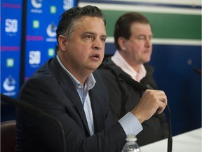 The jobs of Vancouver Canucks head coach Travis Green (left) and GM Jim Benning could be on the line if the Canucks can't find a way out of their current funk.