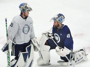 Canucks goalies Thatcher Demko (left) and Braden Holtby had such poor starts to their season that their recent run of good form has only pushed their even-strength save percentage up to third worst in the NHL, to 89.7.
