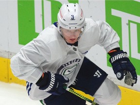 Rookie Jack Rathbone, shown at Canucks training camp in January, picked up four assists in his first two professional games with the AHL’s Utica Comets.