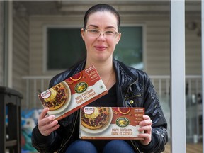Jenna Roman with Nature's Path maple cinnamon waffle boxes outside her home in Surrey. Jenna is trying to buy up all the Nature's Path cinnamon waffles she can find or buy the recipe from Nature's Path. The company has discontinued making the waffles and this is the only solid food her son Jerico will eat.