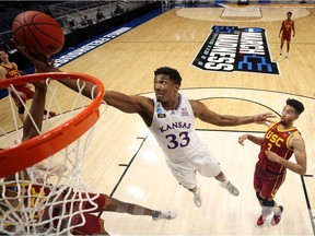David McCormack #33 of the Kansas Jayhawks grabs a rebound against the USC Trojans in the second half of their second round game of the 2021 NCAA Men's Basketball Tournament at Hinkle Fieldhouse on March 22, 2021 in Indianapolis, Indiana.