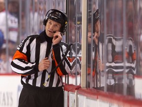 Referee Tim Peel manages a National Hockey League game earlier in his career, something he apparently took a little too far this week, prompting the league to stop assigning him games, several weeks short of his scheduled retirement.
