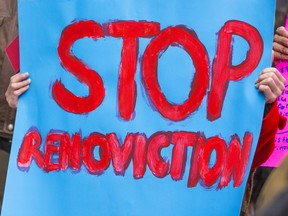 Nov. 9, 2018 file photo of a sign at a renoviction demonstration by the Vancouver Tenants Union. In an effort to prevent illegal renovictions in B.C., a proposed law would require landlords to apply to the Residential Tenancy Branch before they can issue an eviction notice relating to renovations.