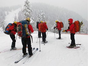 North Shore Rescue volunteers during the search for two men who failed to return home Saturday from an afternoon skiing at the Cypress ski area.
