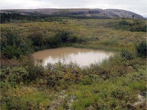 This picture taken on Sept. 17, 2015, in the Nunavik region of northern Canada shows a thermokarst waterhole. Scientists of the Takuvik program aimed to study permafrost thawing on climate.