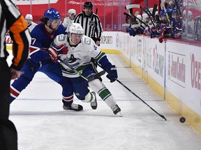 Montreal Canadiens forward Josh Anderson checks Vancouver Canucks forward Nils Hoglander during the first period at the Bell Centre.