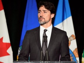 Prime Minister Justin Trudeau attends a memorial service at the University of Alberta for the victims of a Ukrainian passenger plane that crashed in Iran, in Edmonton, Jan. 12, 2020.