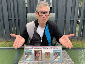 Trader Mike Chark of AASportscards.com shows off some of the cards he’s bought and sold, including rookie cards of Gordie Howe and Wayne Gretzky.