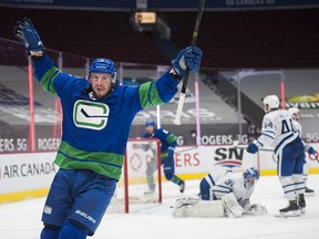 J.T. Miller celebrates his goal as the Canucks rallied in the third period for a 4-2 win over the Maple Leafs on Saturday.