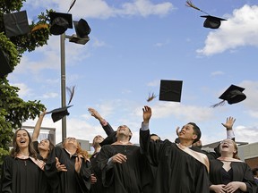 University graduates celebrate after their convocation on Tuesday, June 4, 2019.