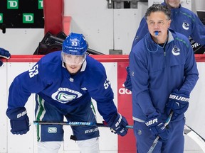 Canucks captain Bo Horvat (left) and head coach Travis Green, pictured at pre-playoff training camp last July, know the club is straddling a fine line, and needs just a little extra to turn their decent performances into victories.