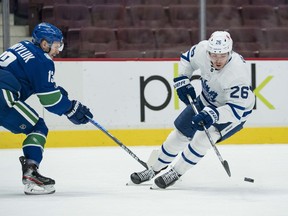 Then-Maple Leafs forward Jimmy Vesey (right) works against his future teammate — Jayce Hawryluk — during the Leafs’ March 4 game at Rogers Arena against the Canucks. Vesey was picked up on waivers by the Canucks on Wednesday.
