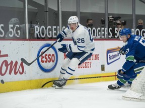 Then-Maple Leafs winger Jimmy Vesey, getting chased by Canucks blueliner Tyler Myers during a game earlier this month, says he’s excited about his new ‘challenge’ in Vancouver. Vesey is good friends with Canucks star J.T. Miller.