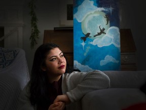 Jade Ryan with her painting of Peter Pan, who she dreamed would rescue her during her childhood.
