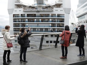 Those were the days: Tourists take photos nearly three years ago as Metro Vancouver’s cruise-ship season kicks off with the arrival of the Star Princess en route to Hawaii, on April 10, 2018.