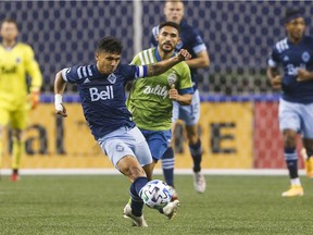 Vancouver Whitecaps forward Fredy Montero passes the ball against Seattle Sounders FC last season.