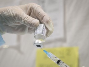 The AstraZeneca vaccine is filled into a syringe on Thursday April 8, 2021.