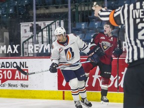 Vancouver Giants centre Tristen Nielsen celebrates while Kamloops Blazers defenceman Inaki Baragano looks chagrined after Nielsen scored one of his three goals in Sunday’s 4-0 Giants victory in Kamloops.