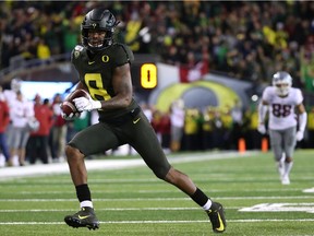 Jevon Holland of the Oregon Ducks runs for a 19-yard pick six against the Washington State Cougars at Autzen Stadium on Oct. 26, 2019, in Eugene, Ore.