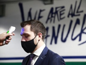 Canucks captain Bo Horvat gets a temperature check before facing the Maple Leafs at Rogers Arena on March 6.