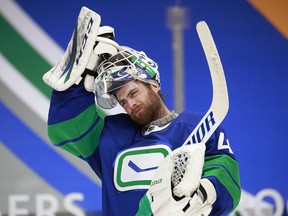 VANCOUVER, BC - APRIL 24: Braden Holtby #49 of the Vancouver Canucks looks on from his crease during their NHL game against the Ottawa Senators at Rogers Arena on April 24, 2021 in Vancouver, British Columbia, Canada.