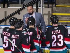 Assistant coach Vernon Fiddler of the Kelowna Rockets speaks to his players during a time out in the second period against the Victoria Royals at Prospera Place on March 26, 2021 in Kelowna, Canada.